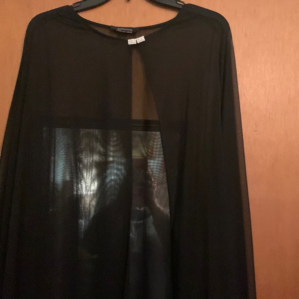 Size large sheer cape with diamond accent at collar